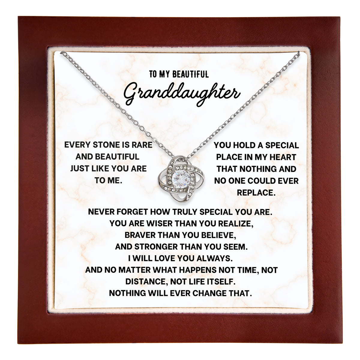 Hand holding an open wooden gift box with a love knot necklace on a To My Beautiful Granddaughter message card