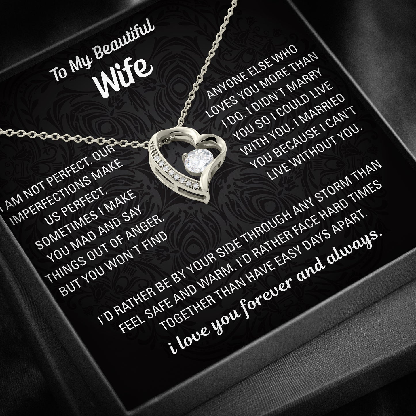 Gold heart necklace displayed on a black To My Beautiful Wife message card inside a black gift box.