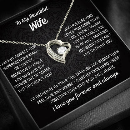 Gold heart necklace displayed on a black To My Beautiful Wife message card inside a black gift box.