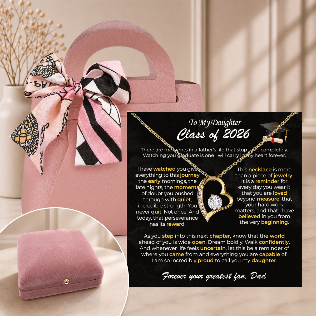 Silver heart necklace on a To My Daughter Class of 2026 card in a pink velvet box beside a pink gift bag with a scarf bow