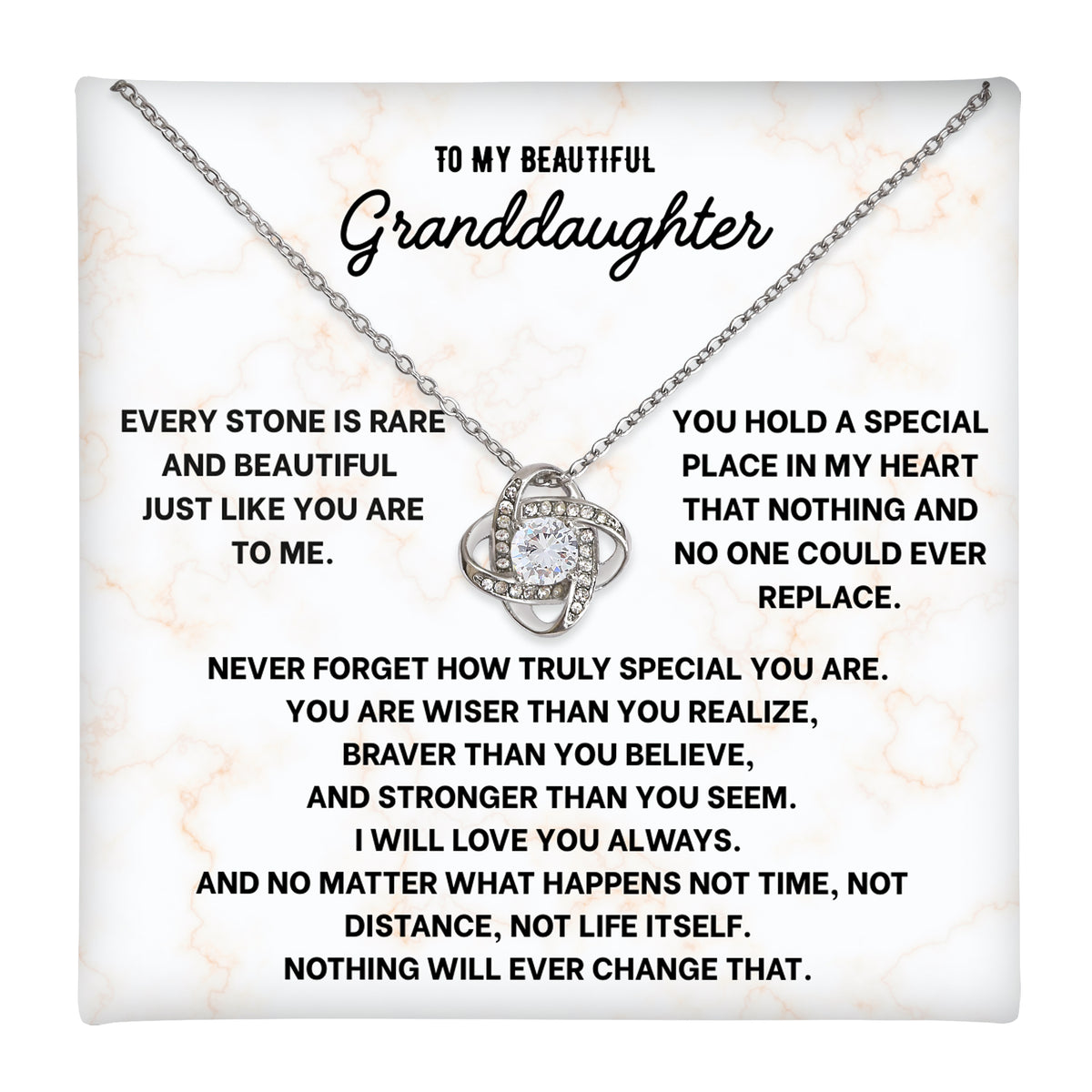 Granddaughter necklace with a message card in a black gift box on white fabric beside baby's breath flowers