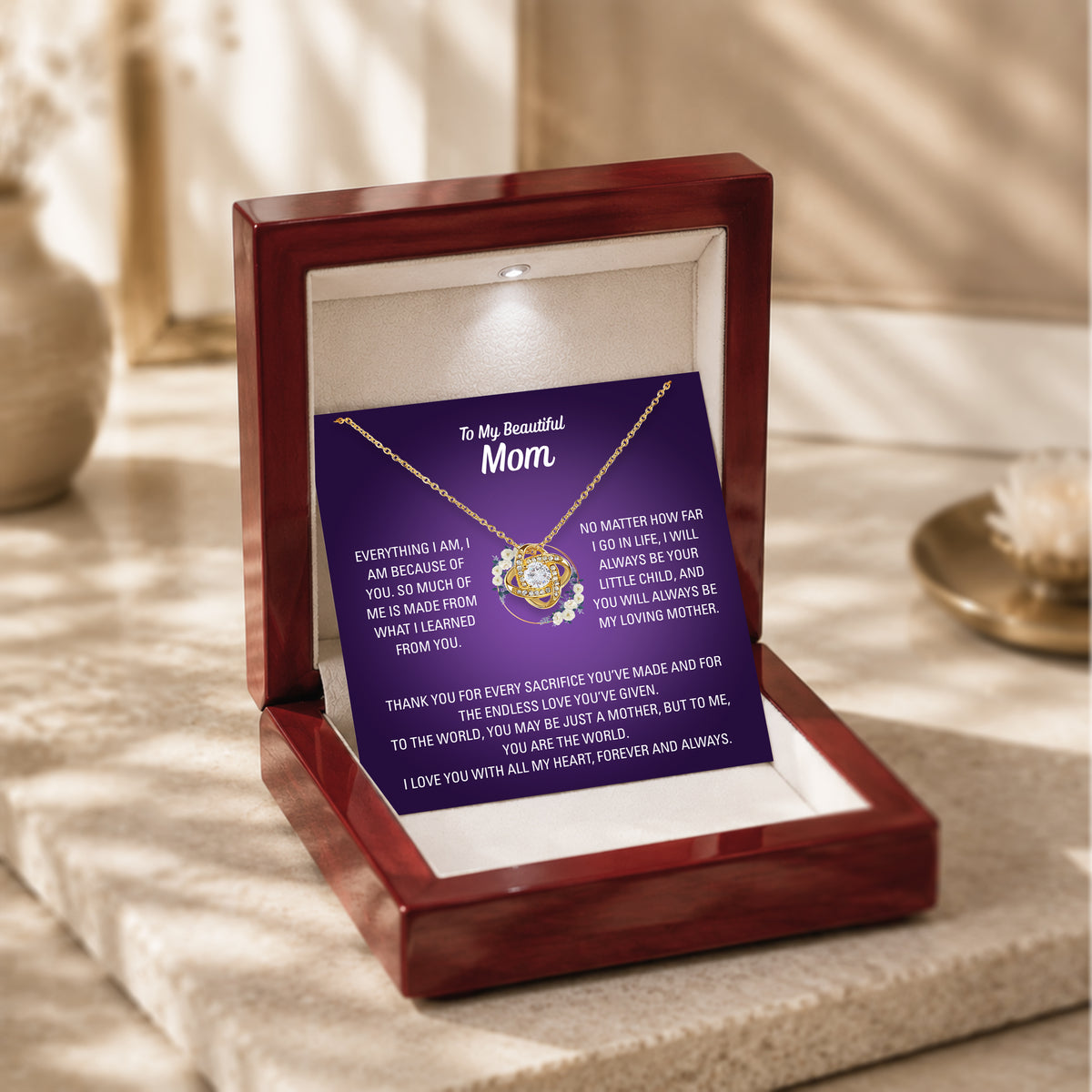 Silver-tone heart necklace and purple Mom message card pictured with wooden presentation box